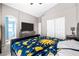 Bright bedroom with large bed, dresser, closet, and a doorway leading to another room at 6050 Golden Corral Trl # 102, Henderson, NV 89011