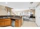 Open floor plan showcasing the kitchen with granite countertops and stainless dishwasher at 6050 Golden Corral Trl # 102, Henderson, NV 89011
