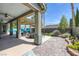 Expansive backyard features a covered patio, pool with mural, landscaping, and a tranquil ambiance at 6173 Sabine Ranch Rd, Las Vegas, NV 89131