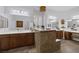 This elegant bathroom features dual sinks, recessed lights, a large mirror, and tile flooring at 6173 Sabine Ranch Rd, Las Vegas, NV 89131