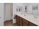 Bathroom featuring a dual sink vanity, large mirror and shower with a tub at 6173 Sabine Ranch Rd, Las Vegas, NV 89131