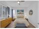 Light and bright bedroom featuring a ceiling fan, and warm neutral decor at 6173 Sabine Ranch Rd, Las Vegas, NV 89131