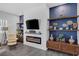 Close-up of the modern fireplace and custom shelving in the living room, perfect for cozy evenings at 6173 Sabine Ranch Rd, Las Vegas, NV 89131