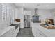 The well-appointed kitchen offers an island, stainless appliances, and plenty of counter space at 6173 Sabine Ranch Rd, Las Vegas, NV 89131