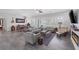Open-concept living room with custom lighting, and lots of seating at 6173 Sabine Ranch Rd, Las Vegas, NV 89131
