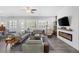 Expansive living room featuring a modern fireplace, and lots of natural light at 6173 Sabine Ranch Rd, Las Vegas, NV 89131