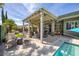 Inviting covered patio features ample seating areas with a view of the pool, great for entertaining and outdoor living at 6173 Sabine Ranch Rd, Las Vegas, NV 89131