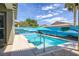 Inviting backyard pool features a custom painted mural and an umbrella-shaded lounge area at 6173 Sabine Ranch Rd, Las Vegas, NV 89131