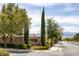 Carson Ranch street view featuring landscaping, trees, and a community sign at 6173 Sabine Ranch Rd, Las Vegas, NV 89131