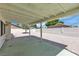 Covered patio and low maintenance yard featuring decorative rock and privacy walls at 6204 Robin Hood Cir, Las Vegas, NV 89108