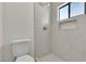 Updated bathroom with a tiled walk-in shower, brushed fixtures, and modern toilet at 6204 Robin Hood Cir, Las Vegas, NV 89108