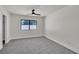 This bedroom features neutral decor, soft carpeting, and a window providing natural light at 6204 Robin Hood Cir, Las Vegas, NV 89108