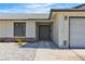 Charming home exterior showcasing desert landscaping, a gray roof, and a cozy front entrance at 6204 Robin Hood Cir, Las Vegas, NV 89108