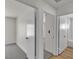 Bright hallway featuring carpet and hard surface flooring and white doors at 6204 Robin Hood Cir, Las Vegas, NV 89108