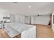 The kitchen features a marble island and stainless steel appliances with seamless access to the living room at 6204 Robin Hood Cir, Las Vegas, NV 89108