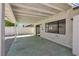 The covered patio overlooks the landscaped backyard with decorative rocks and privacy walls at 6204 Robin Hood Cir, Las Vegas, NV 89108