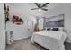Serene bedroom with plush carpeting, a comfortable bed, and subtle decor touches at 6318 Amber Sunrise St, North Las Vegas, NV 89031
