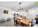 Open dining area flows into a modern kitchen, creating a cohesive and inviting space for gatherings at 6318 Amber Sunrise St, North Las Vegas, NV 89031
