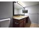 Bathroom featuring a granite countertop, vanity, tile floor, framed mirror, and modern fixtures at 634 Oakmont Ave # 1903, Las Vegas, NV 89109