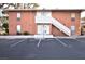 A two-story building with a brick facade and parking spaces at 634 Oakmont Ave # 1903, Las Vegas, NV 89109