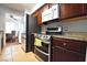 Kitchen with stainless steel appliances, granite countertops, dark cabinets, and tile flooring at 634 Oakmont Ave # 1903, Las Vegas, NV 89109