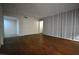 A living room with hardwood floors and neutral-colored walls at 634 Oakmont Ave # 1903, Las Vegas, NV 89109