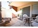 Private patio area with stylish decor, table and chairs for outdoor relaxation at 634 Oakmont Ave # 1903, Las Vegas, NV 89109