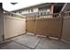 Private patio area with concrete flooring and beige wooden fence, perfect for outdoor relaxation at 634 Oakmont Ave # 1903, Las Vegas, NV 89109