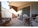 Cozy outdoor patio featuring table, chairs, concrete flooring, and sliding glass door at 634 Oakmont Ave # 1903, Las Vegas, NV 89109