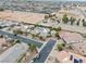 Picture of desert home with large backyard pool, desert landscaping, tile roof, circular driveway, and attached garage at 7504 Frittata Ave, Las Vegas, NV 89113