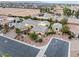 Lovely aerial view of desert home with desert landscaping, tile roof, circular driveway, attached garage, and possible in-law suite at 7504 Frittata Ave, Las Vegas, NV 89113