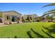 Spacious backyard featuring well-maintained turf and mature landscaping, perfect for outdoor activities at 7504 Frittata Ave, Las Vegas, NV 89113
