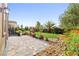 Lush backyard with a well manicured lawn and beautiful desert landscaping at 7504 Frittata Ave, Las Vegas, NV 89113