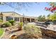 Backyard oasis with a pool, spa, patio, and desert landscaping at 7504 Frittata Ave, Las Vegas, NV 89113