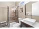 Modern bathroom featuring a glass-enclosed shower and a sleek vessel sink at 7504 Frittata Ave, Las Vegas, NV 89113