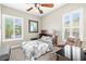 Bedroom with a ceiling fan, shutters, recliner, and carpet flooring at 7504 Frittata Ave, Las Vegas, NV 89113