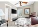 Bedroom with a ceiling fan, shutters, wall mounted TV, and carpet flooring at 7504 Frittata Ave, Las Vegas, NV 89113