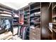 Organized walk-in closet with custom shelving and drawers for efficient storage at 7504 Frittata Ave, Las Vegas, NV 89113