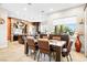 Spacious dining room showcasing modern table, chairs, and view to the manicured grounds at 7504 Frittata Ave, Las Vegas, NV 89113