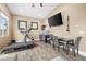 Well-lit exercise room featuring a treadmill, fitness equipment, and a functional layout at 7504 Frittata Ave, Las Vegas, NV 89113
