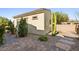 Back house with desert landscaping and walkway at 7504 Frittata Ave, Las Vegas, NV 89113