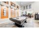 Bright game room features a billiards table, modern art, and an open floor plan at 7504 Frittata Ave, Las Vegas, NV 89113