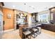 Gourmet kitchen boasts dark cabinetry, granite counters, brick arch, and stainless appliances at 7504 Frittata Ave, Las Vegas, NV 89113