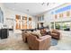 Bright living area boasting ample seating, recessed lighting, and a large window at 7504 Frittata Ave, Las Vegas, NV 89113