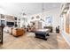 Spacious living area featuring a pool table, tile floors, and a stone fireplace at 7504 Frittata Ave, Las Vegas, NV 89113