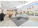 Open concept living space with modern furnishings, ample seating, and backyard views at 7504 Frittata Ave, Las Vegas, NV 89113