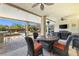 Outdoor space for entertaining with outdoor tv, overlooking a pristine pool and landscaping at 7504 Frittata Ave, Las Vegas, NV 89113