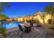 Backyard oasis with pool, spa, and outdoor seating, ideal for relaxation and entertainment at 7504 Frittata Ave, Las Vegas, NV 89113