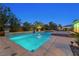 Tranquil pool with desert landscaping creating a private and serene outdoor space at 7504 Frittata Ave, Las Vegas, NV 89113
