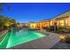 Outdoor living space with pool, spa, and covered patio, perfect for entertaining at 7504 Frittata Ave, Las Vegas, NV 89113